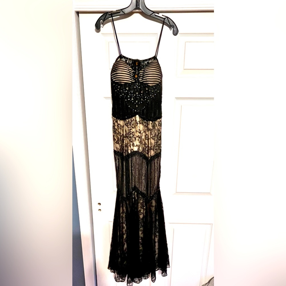 Elegant custom evening gown. One of a kind ! Intricate beading and unique design
